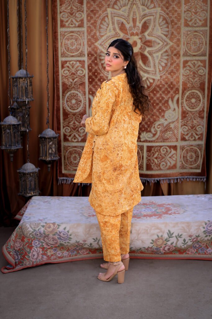 Woman in a hand-printed mustard outfit